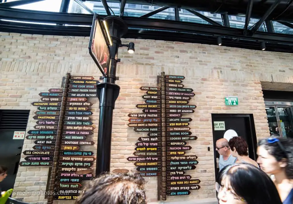Sign with directions to all stores at Sarona Market
